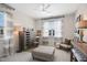 Bedroom featuring a window for natural light, a dresser, and a comfy chair creating a cozy and inviting space at 241 Teague St, Wake Forest, NC 27587