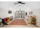 Large bonus room features recessed lighting, ceiling fans and is staged as a bedroom/gym area at 241 Teague St, Wake Forest, NC 27587
