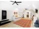 Spacious bonus room includes a daybed, gym equipment and features an open doorway to another room at 241 Teague St, Wake Forest, NC 27587