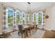 Charming dining room with natural light, a rustic wood table, and stylish decor, perfect for Gathering meals at 241 Teague St, Wake Forest, NC 27587