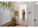Inviting entryway featuring a bench, coat hooks, and decorative accents, creating a welcoming first impression at 241 Teague St, Wake Forest, NC 27587