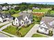 Stunning aerial shot of a custom-built home with meticulous landscaping and a large, well-manicured lawn at 241 Teague St, Wake Forest, NC 27587