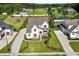 Beautiful modern farmhouse with pristine landscaping, covered porch, and three-car garage on an expansive lot at 241 Teague St, Wake Forest, NC 27587