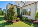 Charming home featuring professionally landscaped yard with verdant greenery and manicured lawn at 241 Teague St, Wake Forest, NC 27587