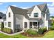 Angle of the home shows the light colored brick and landscaping at 241 Teague St, Wake Forest, NC 27587
