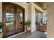Inviting front porch with double doors and brick ceiling at 241 Teague St, Wake Forest, NC 27587