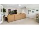 Spacious living room featuring a large sofa and a TV, perfect for relaxing and entertaining with a warm, inviting ambiance at 241 Teague St, Wake Forest, NC 27587
