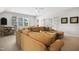 Living room featuring a sectional sofa, dining area, and lots of natural light, ideal for gatherings and relaxed living at 241 Teague St, Wake Forest, NC 27587