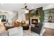 Comfortable living room with fireplace, built-in shelves, and stairway access at 241 Teague St, Wake Forest, NC 27587
