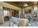 Covered patio with a fireplace, comfortable seating, and a view of the backyard at 241 Teague St, Wake Forest, NC 27587