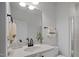 Bright bathroom featuring a vanity with white cabinets and black hardware, complemented by a glass shower at 2810 Bedford Green Dr # 5, Raleigh, NC 27604