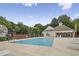 Community pool featuring lounge chairs, a shaded pavilion, and surrounding greenery at 2810 Bedford Green Dr # 5, Raleigh, NC 27604