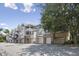 A row of multi-story condominium buildings with garages and balconies on a sunny day at 2810 Bedford Green Dr # 5, Raleigh, NC 27604