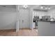 Bright kitchen featuring white cabinets, stainless steel appliances, and a wood-look floor at 2810 Bedford Green Dr # 5, Raleigh, NC 27604