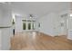 Bright open living room with light wood floors and glass doors leading to the outside at 2810 Bedford Green Dr # 5, Raleigh, NC 27604