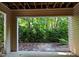Covered patio looking out to a private, wooded area; a peaceful outdoor retreat at 2810 Bedford Green Dr # 5, Raleigh, NC 27604