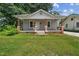 Charming single-story home with a covered porch and a well-maintained lawn at 2927 S Church St, Rocky Mount, NC 27803