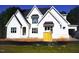 New construction home showcasing a modern white facade, gabled roof and a manicured lawn in a suburban setting at 3004 William Frederick Way, Raleigh, NC 27603