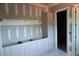 Bright, unfinished living room showcasing custom cabinets and tile floors during renovations at 3004 William Frederick Way, Raleigh, NC 27603
