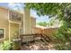 Backyard featuring a spacious deck, mature trees, and fully fenced yard for privacy at 303 Applecross Dr, Cary, NC 27511