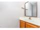 A well-lit half bathroom with a vanity, mirror, and neutral decor at 303 Applecross Dr, Cary, NC 27511