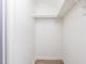 A simple walk-in closet featuring ample storage and shelving space at 303 Applecross Dr, Cary, NC 27511