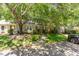 Inviting exterior view showcasing the home's landscaping and curb appeal, shaded by mature trees at 303 Applecross Dr, Cary, NC 27511