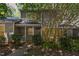 Charming home featuring well-maintained landscaping, welcoming front porch, and gray siding at 303 Applecross Dr, Cary, NC 27511