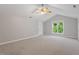 A large bedroom features high vaulted ceiling with fan and a well-lit window at 318 Riggsbee Farm Dr, Cary, NC 27519