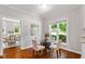 Cozy breakfast nook with hardwood floors, natural light, and stylish decor for morning coffee at 318 Riggsbee Farm Dr, Cary, NC 27519