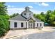 Community clubhouse with stone accents, bike rack, and well-manicured landscaping at 318 Riggsbee Farm Dr, Cary, NC 27519