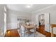 Charming dining room with hardwood floors, wainscoting, and abundant natural light for delightful meals at 318 Riggsbee Farm Dr, Cary, NC 27519