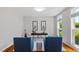 Bright home office with hardwood floors, natural light, and comfortable seating perfect for productivity at 318 Riggsbee Farm Dr, Cary, NC 27519