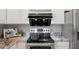 Elegant kitchen featuring granite countertops, stainless steel appliances, and ample space for meal preparation at 318 Riggsbee Farm Dr, Cary, NC 27519