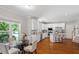 Open kitchen with modern appliances, granite countertops, and a breakfast bar that leads to the dining area at 318 Riggsbee Farm Dr, Cary, NC 27519