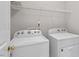 Practical laundry area with a washer, dryer, and shelving for organized storage and easy access at 318 Riggsbee Farm Dr, Cary, NC 27519