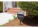 SimpliSafe security sign in a landscaped yard, indicating home security system at 318 Riggsbee Farm Dr, Cary, NC 27519