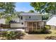 Expansive backyard featuring an enclosed porch, a concrete patio, and lots of shaded areas at 3421 Tunas St, Raleigh, NC 27616