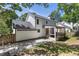 View of the home's backyard featuring an enclosed porch and a concrete patio area for outdoor enjoyment at 3421 Tunas St, Raleigh, NC 27616