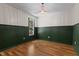 An empty bedroom is freshly painted with a modern light fixture and natural light at 3421 Tunas St, Raleigh, NC 27616