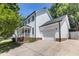 Charming two-story home with white siding, attached garage, and well-maintained landscaping at 3421 Tunas St, Raleigh, NC 27616