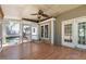 Screened porch with paneled ceiling, hardwood floors and ceiling fan at 3421 Tunas St, Raleigh, NC 27616