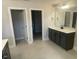 Bathroom with double sink vanity and separate doorways to the toilet and shower area at 3509 Bailey Lake Dr, Fuquay Varina, NC 27526