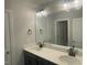 Bathroom featuring a double vanity with modern fixtures and a large mirror at 3509 Bailey Lake Dr, Fuquay Varina, NC 27526