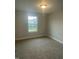 Bedroom with neutral carpet and a window letting in natural light at 3509 Bailey Lake Dr, Fuquay Varina, NC 27526