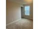 Bedroom with neutral carpet, a window letting in natural light, and a door at 3509 Bailey Lake Dr, Fuquay Varina, NC 27526