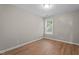 Cozy bedroom with wood floor and a window bringing in natural light at 3782 Loblolly Dr # 5, Rocky Mount, NC 27804