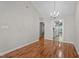 Hardwood floors in a dining area, connecting to a bright kitchen through doorway at 3782 Loblolly Dr # 5, Rocky Mount, NC 27804