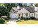 Inviting single-story home with a welcoming front porch, lush landscaping, and an attached garage at 3782 Loblolly Dr # 5, Rocky Mount, NC 27804