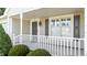 Charming front porch with white railings, a stylish entry door, and large windows at 3782 Loblolly Dr # 5, Rocky Mount, NC 27804